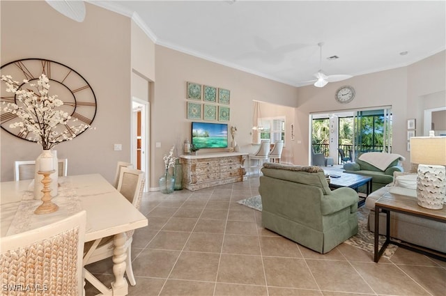 tiled living room with ornamental molding and ceiling fan