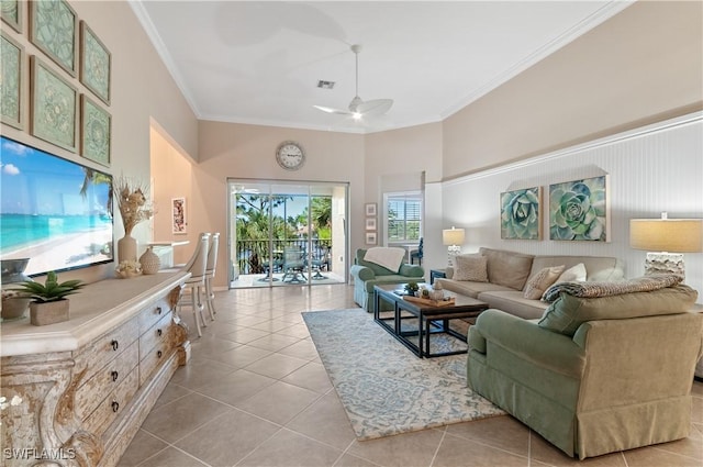 living room with crown molding, ceiling fan, and light tile patterned floors