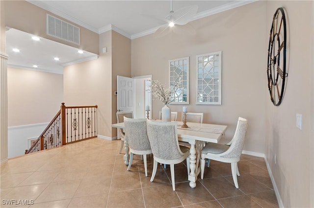 dining room featuring light tile patterned floors, ornamental molding, and ceiling fan