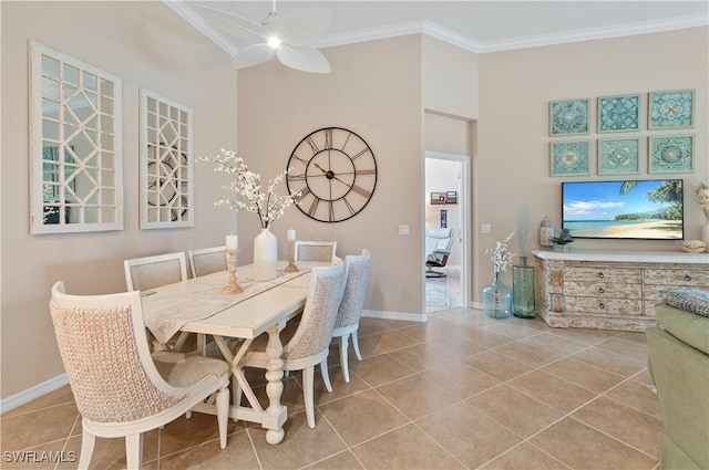 tiled dining area featuring crown molding and ceiling fan