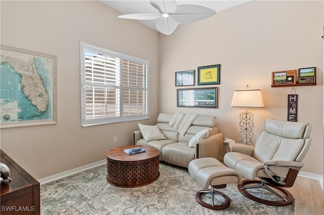 living area with ceiling fan and hardwood / wood-style floors