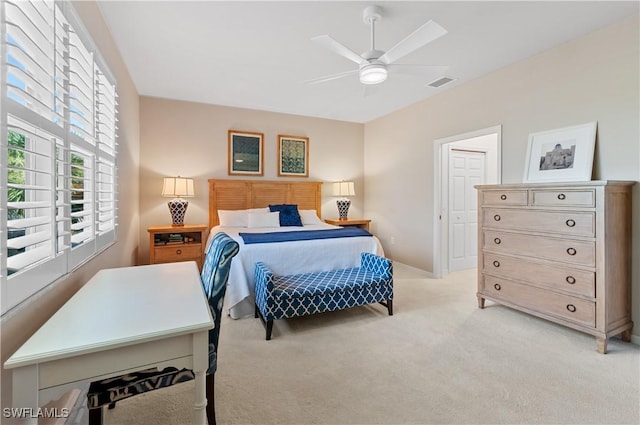 carpeted bedroom with ceiling fan