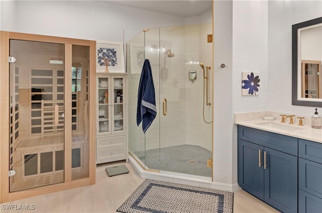 bathroom with vanity and an enclosed shower