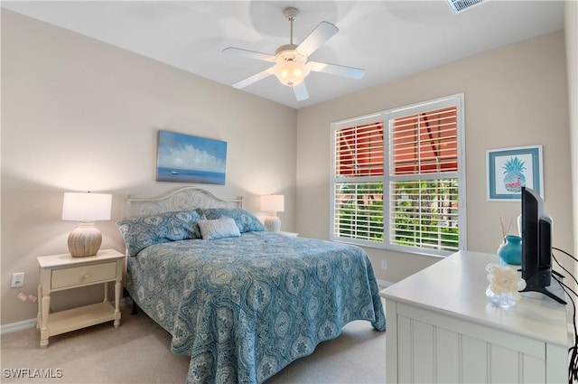 bedroom with light colored carpet and ceiling fan