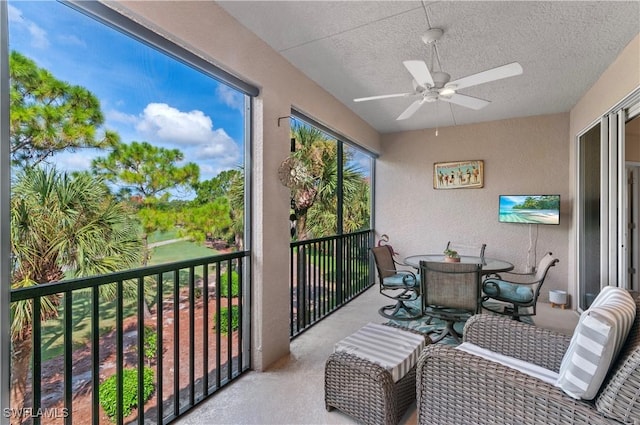 sunroom / solarium with ceiling fan