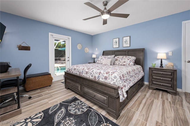 bedroom with light wood-type flooring, access to outside, and ceiling fan