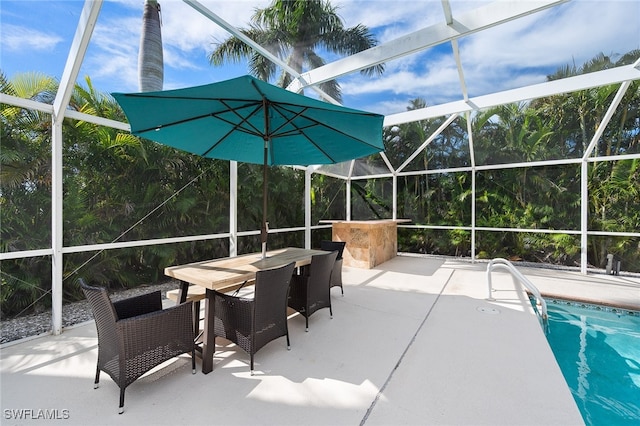 view of patio / terrace featuring a lanai