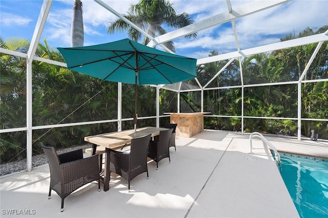 view of patio featuring a bar and a lanai