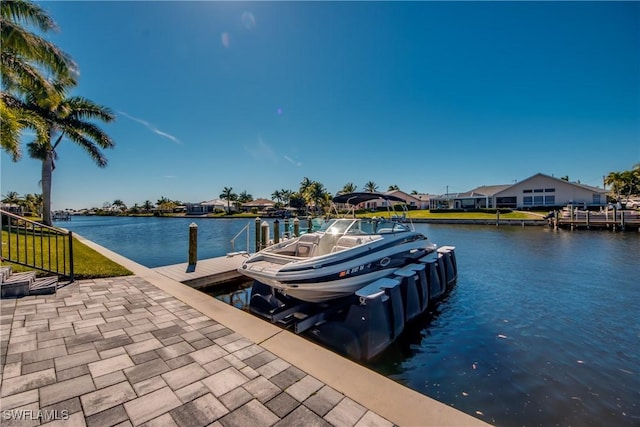 dock area with a water view and boat lift