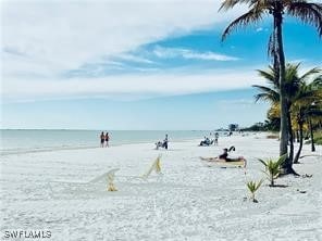 property view of water featuring a beach view