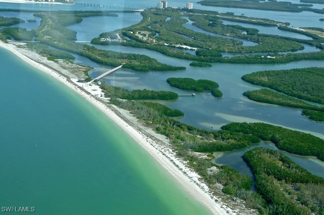 bird's eye view featuring a view of the beach and a water view