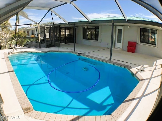 view of pool with a lanai and a patio area