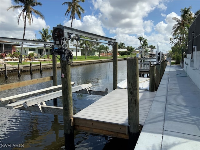 dock area with a water view