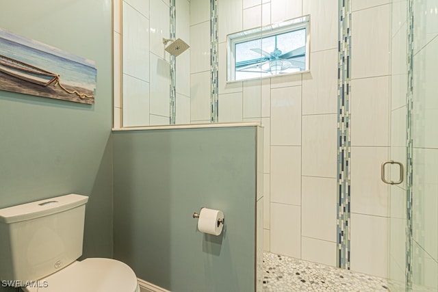 bathroom with an enclosed shower and toilet