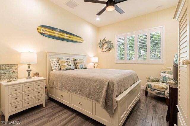 bedroom featuring dark hardwood / wood-style floors and ceiling fan