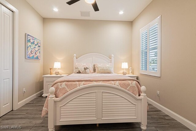 bedroom featuring dark hardwood / wood-style floors and ceiling fan