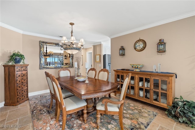 dining space with crown molding and an inviting chandelier