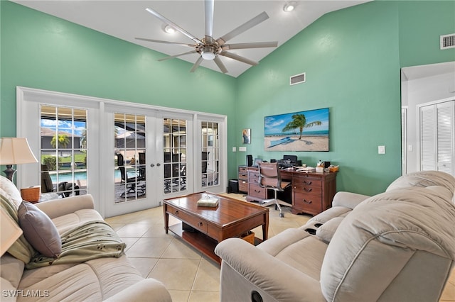 tiled living room featuring high vaulted ceiling, french doors, and ceiling fan