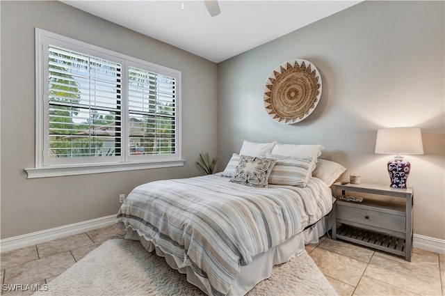 tiled bedroom with ceiling fan