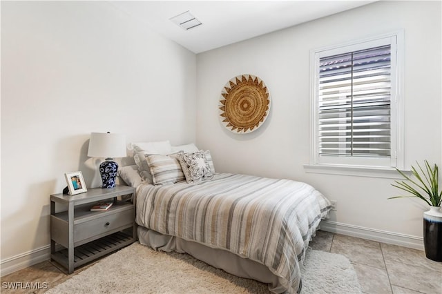 tiled bedroom with baseboards