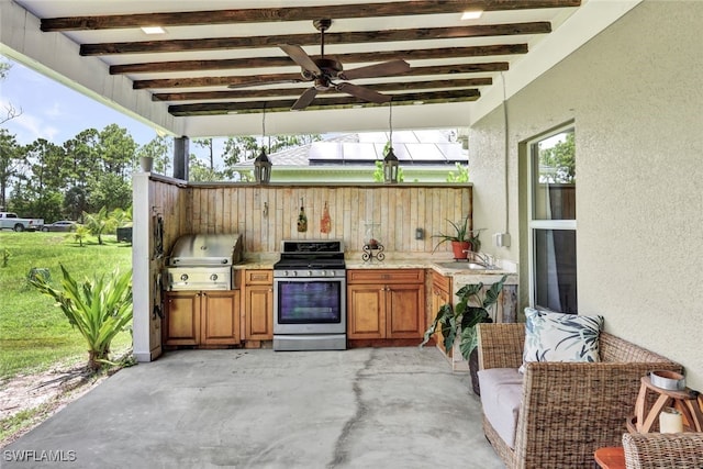 view of patio featuring a sink, grilling area, and exterior kitchen