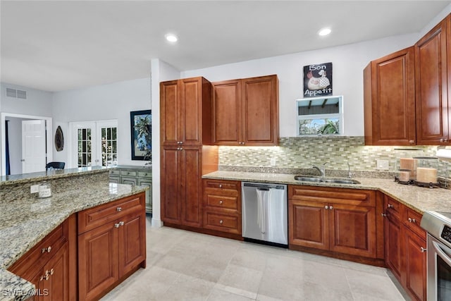 kitchen featuring visible vents, a sink, french doors, range, and dishwasher