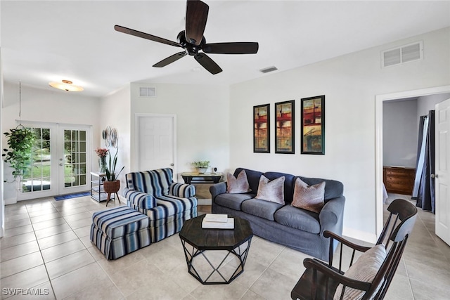 tiled living room featuring french doors and ceiling fan