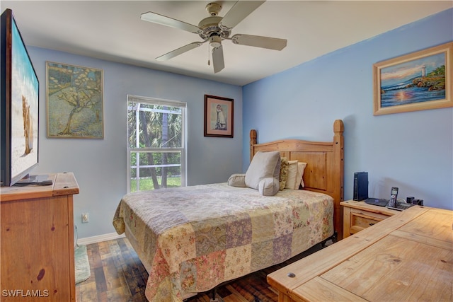 bedroom with ceiling fan and dark hardwood / wood-style flooring