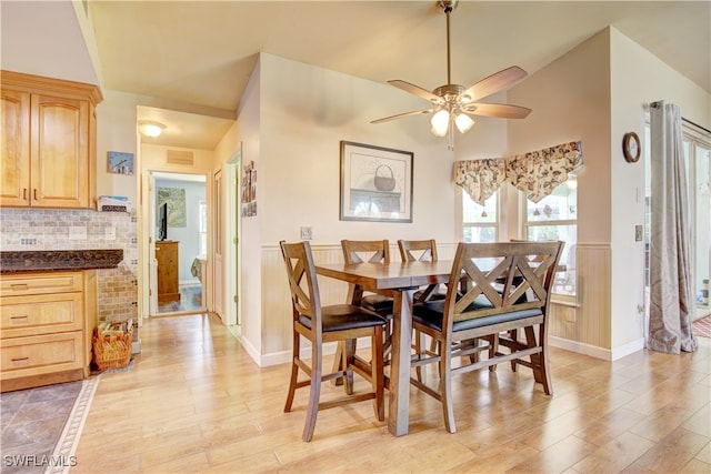 dining area featuring light hardwood / wood-style floors and ceiling fan