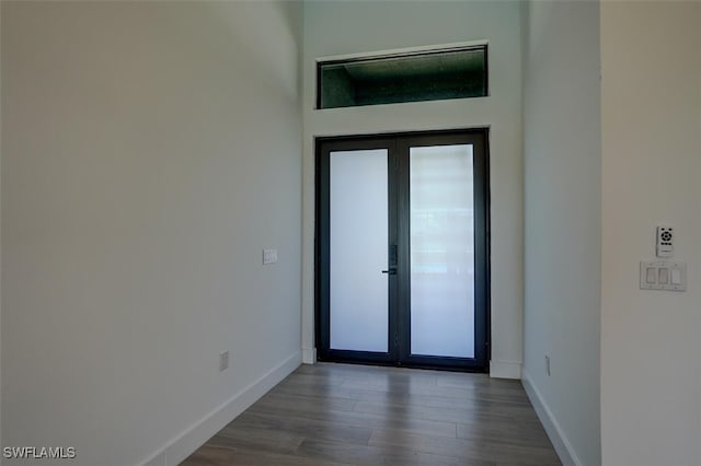 interior space with french doors and dark wood-type flooring