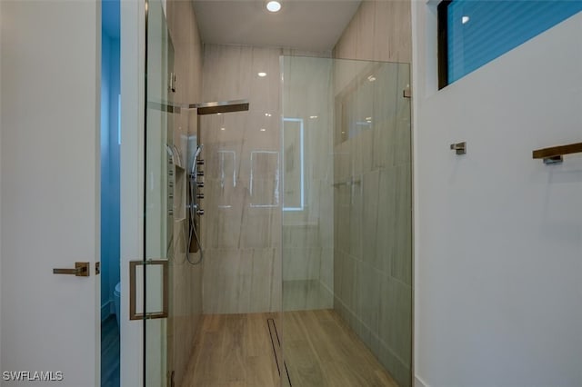 bathroom with toilet and walk in shower