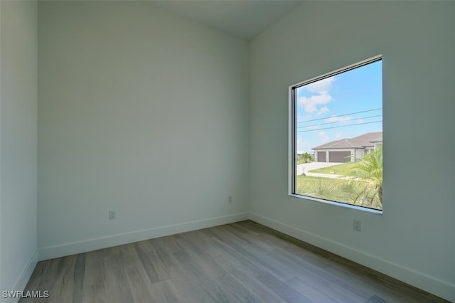 spare room featuring light hardwood / wood-style floors