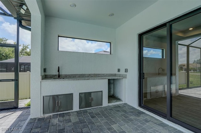 interior space with a wealth of natural light and sink