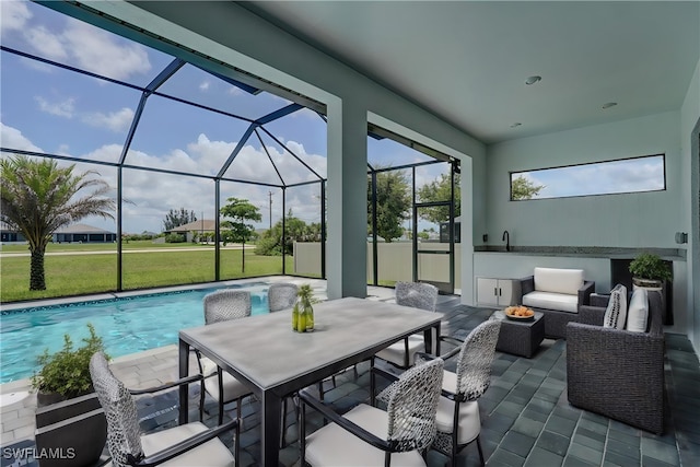 view of patio / terrace featuring glass enclosure