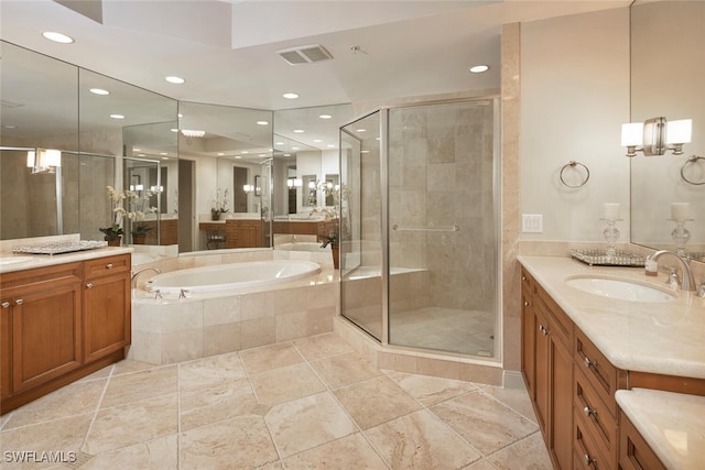 bathroom featuring vanity and shower with separate bathtub