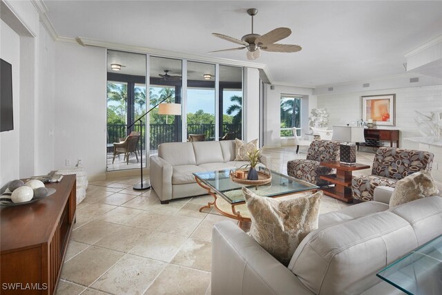 living room with crown molding, light tile patterned floors, and ceiling fan