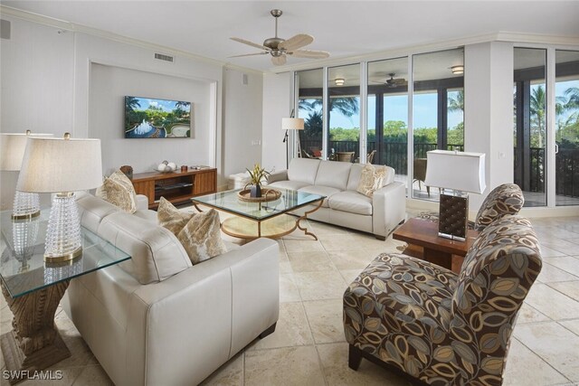 living room featuring light tile patterned flooring, a wall of windows, crown molding, and ceiling fan