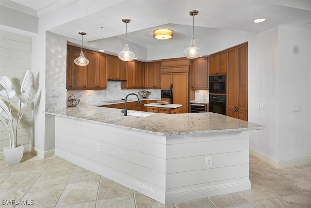 kitchen with pendant lighting, sink, black appliances, light stone countertops, and kitchen peninsula