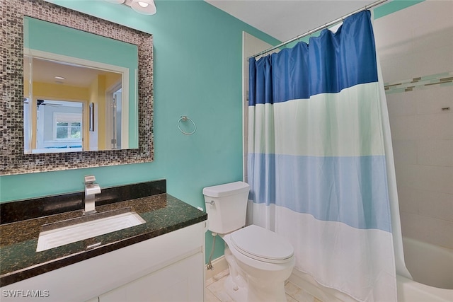 full bathroom featuring vanity, toilet, shower / bathtub combination with curtain, and tile patterned floors