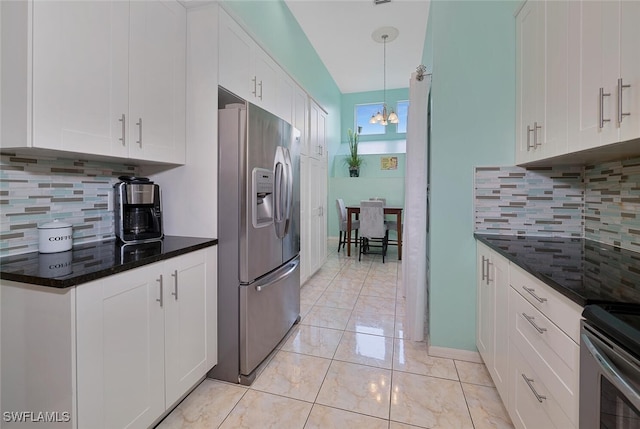 kitchen with white cabinetry, backsplash, and stainless steel refrigerator with ice dispenser