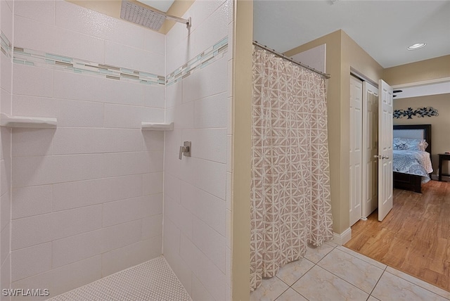 bathroom with hardwood / wood-style floors