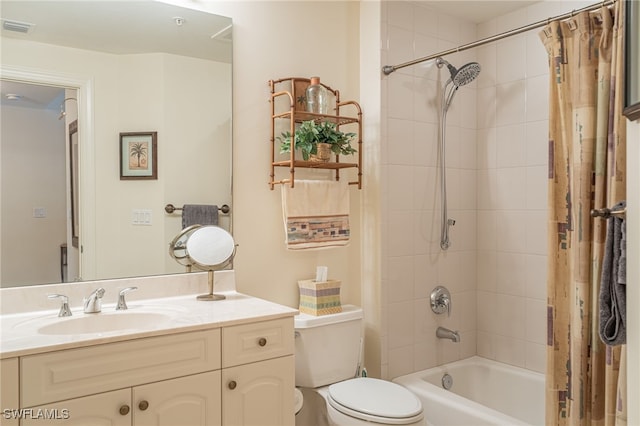 full bathroom with vanity, shower / bathtub combination with curtain, and toilet