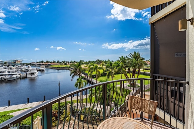 balcony featuring a water view