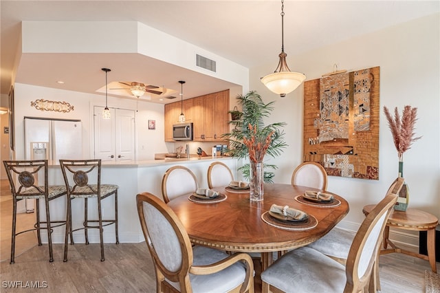 dining room with light wood-type flooring