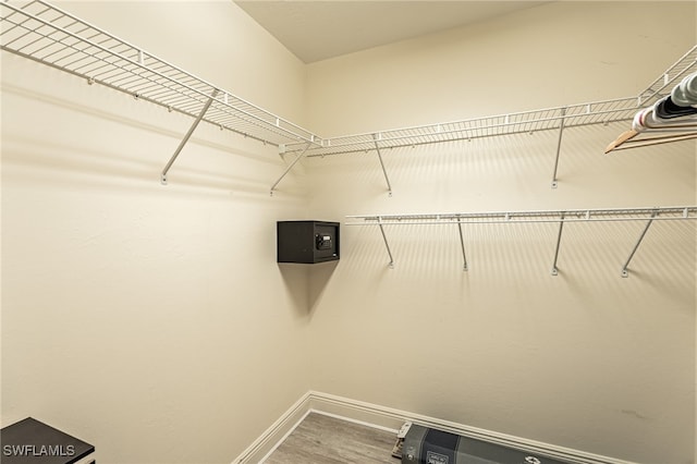 walk in closet featuring hardwood / wood-style flooring