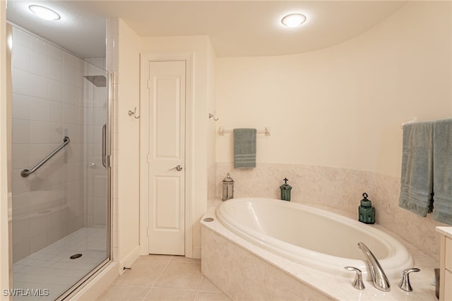 bathroom featuring vanity, tile patterned floors, and plus walk in shower