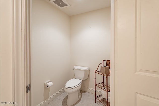 bathroom with tile patterned floors and toilet