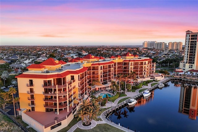 aerial view at dusk with a water view