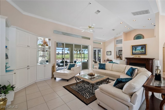 living room with ceiling fan, ornamental molding, high vaulted ceiling, and light tile patterned floors