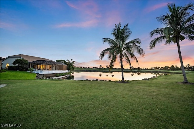 yard at dusk with a water view